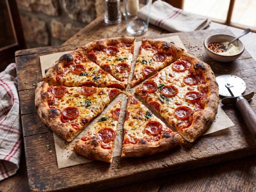 Pizza with uneven slices - representing cost sharing.