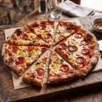 Pizza with uneven slices - representing cost sharing.